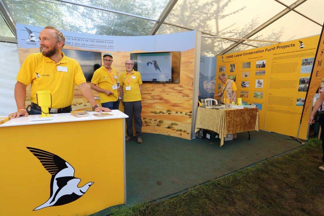 Plate 5. Setting up the OSME stand at the British Birdfair 2019. © Guy Shorrock