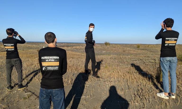 Young falconers learning about bird identification and conservation